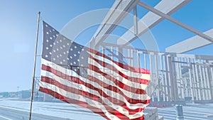 American Flag Waving Slow Motion With Home Construction Wood Framing Background