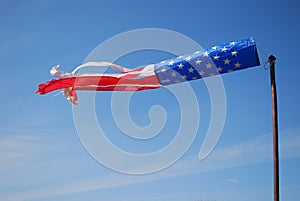 American flag windy wind sock blue sky