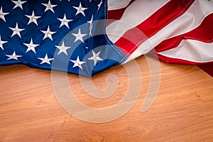 American flag on wood background.