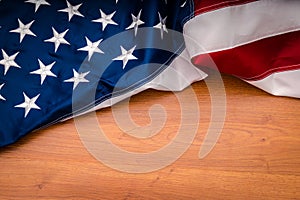 American flag on wood background.