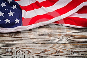 American flag on wood background .