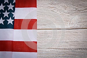 American flag on a wooden background. The concept of freedom and patriotism