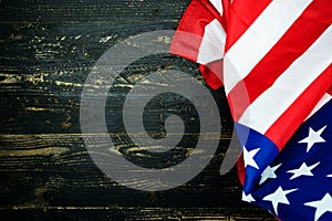 American flags on black wood background,image for 4th of july independence day Flag of USA on dark wooden wall texture background