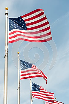 American flags on the blue sky