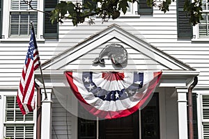 American flags on a colonial house