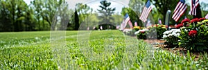 American flags honoring veterans on memorial day in national cemetery with copy space