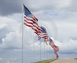 American flags of a memorial for veterans flying in the breeze