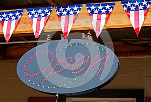 American flags and open sign