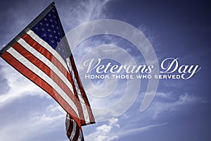 American flags with a Veterans Day greeting