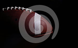 American Football Against a Black Background with Copyspace to t