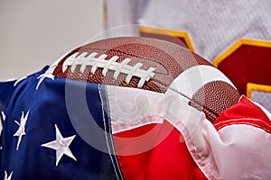 American football on American flag, old glory.