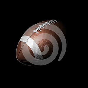 American football ball on black background