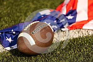 american football ball and flag