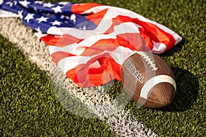 american football ball and flag