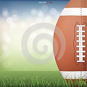 American football ball on green grass field with light blurred bokeh background. Vector