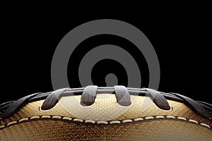 American football ball, helmet on a dark background in black and gold style. Playoff games, professional championship. Sports,