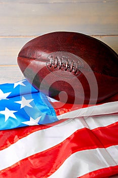 American football ball and old glory flag