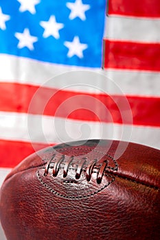 American football ball and old glory flag