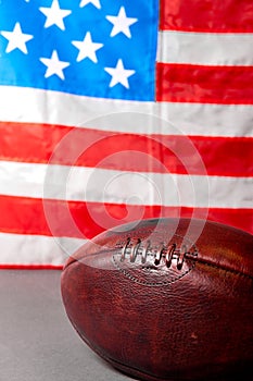 American football ball and old glory flag