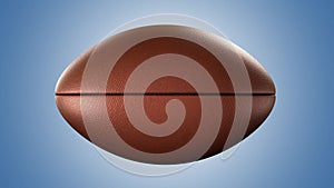 American football ball rotating in motion on blue screen. Looped American football 3d Animation. 3d. 4K