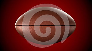 American football ball rotating in motion on red screen. Looped American football 3d Animation. 3d. 4K