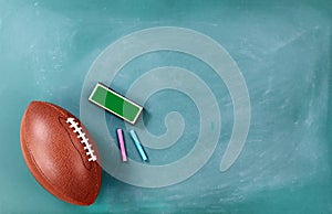 American football on chalkboard with eraser and chalk