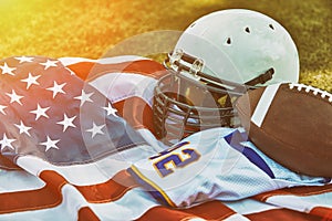 American football concept. a uniform of an American football player on the grass a park. Patriotism of the national game