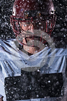 American Football Field: Lonely Athlete Warrior Standing on a Field Holds his Helmet and Ready to Play. Player Preparing