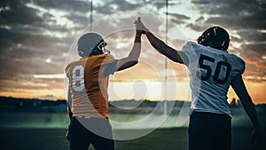 American Football Game Start Teams Ready: Two Professional Players Walk on Field Determined to Win