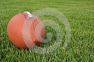 American Football on Grass Field