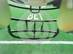 American Football helmet on field with yard lines