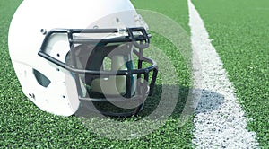 American Football helmet on field with yard lines