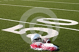 American Football, Helmet and Pom Poms on Field