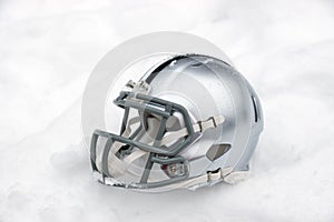 American football helmet in snow