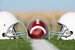 American Football with Helmets on the Field photo