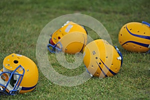 American football helmets on grass