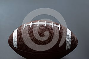 American football isolated on black background. Sport object concept