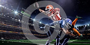 American football player in action on stadium