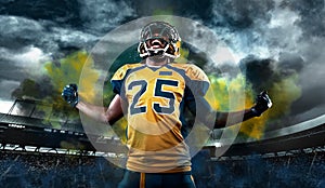 American football player, athlete in helmet with ball on stadium. Sport wallpaper with copyspace.