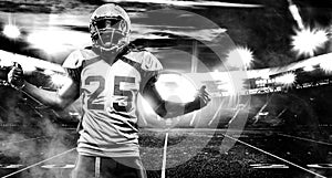 American football player, athlete in helmet on stadium. Black and white photo. Sport wallpaper with copyspace.