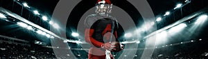 American football player, athlete sportsman in red helmet on stadium background. Sport and motivation wallpaper. Wide