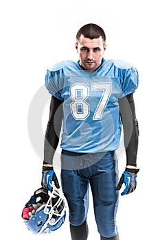 American Football Player with blue uniform on the scrimmage line. White background