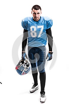 American Football Player with blue uniform on the scrimmage line. White background