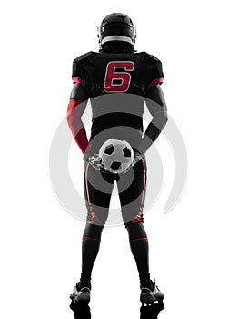 American football player holding soccer ball silhouette