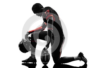 American football player kneeling silhouette