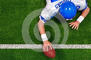 American football player one handed touchdown photo