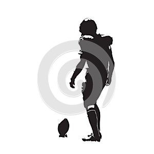 American football player preparing for kick, isolated vector silhouette. Team sport