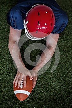 American football player scoring a touchdown