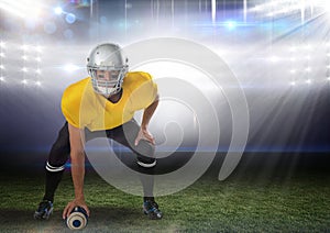 american football player standing in stadium starting game