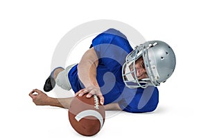 American football player struggling to catch the ball
